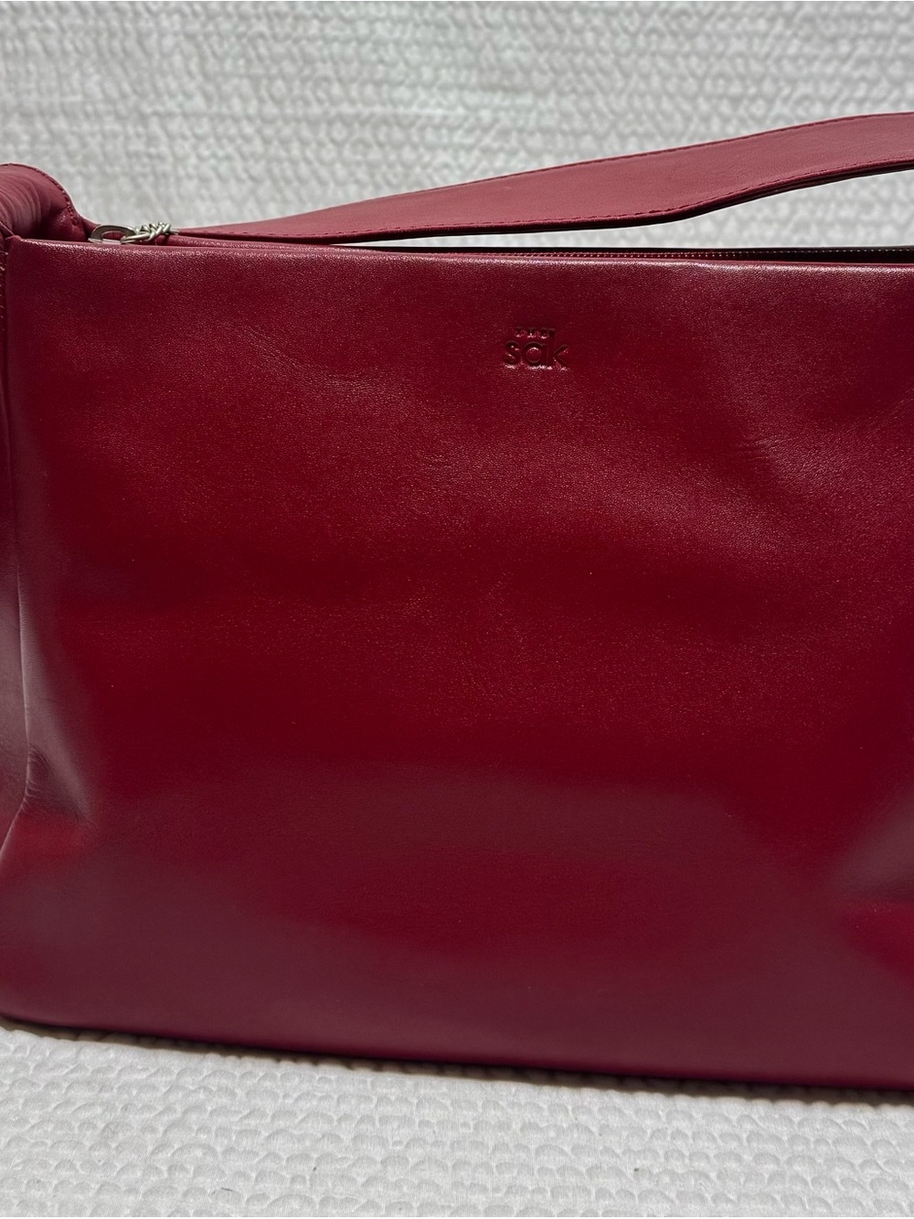 The Sak red leather shoulder bag zip closure, detachable strap  interior pockets